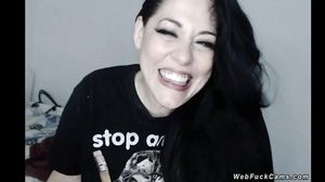 Huge tits babe sucks black dildo on cam