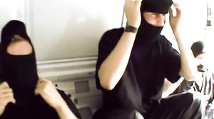 Beautiful brunette taking two cocks at once