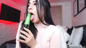 Busty clothed camgirl sucks vibrator