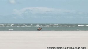 Horny latina gets a double penetration at the beach