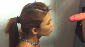 Pissed-On Thai Transsexual Mint Gives Blowjob