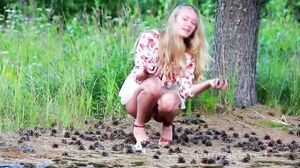 Ella relaxes at the edge of the forest