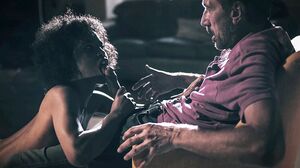 Photographer makes an ebony model squirt