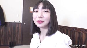 A cute college student cafe worker with big eyes like a