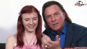 EroCom - Young petite woman with red hair fucks in a casting an older guy