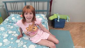 Redhead Madelyn puts a cock and balls down her throat