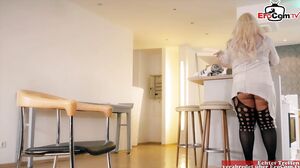 EroCom - Fat blonde milf with big tits in a fishnet outfit