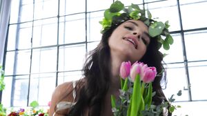 Sweet petite brunette gets fucked in a bed of flowers