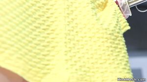 Babe in yellow panties rubs dildo