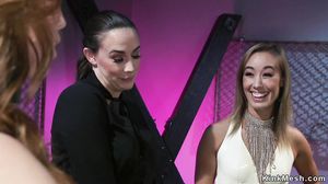 Busty lesbian whips butts to two slaves