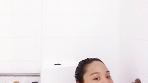 Asian Babe Playing In Bath