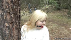 Blonde slave whipped outdoor in public