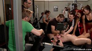 Tied redhead anal banged at public gym